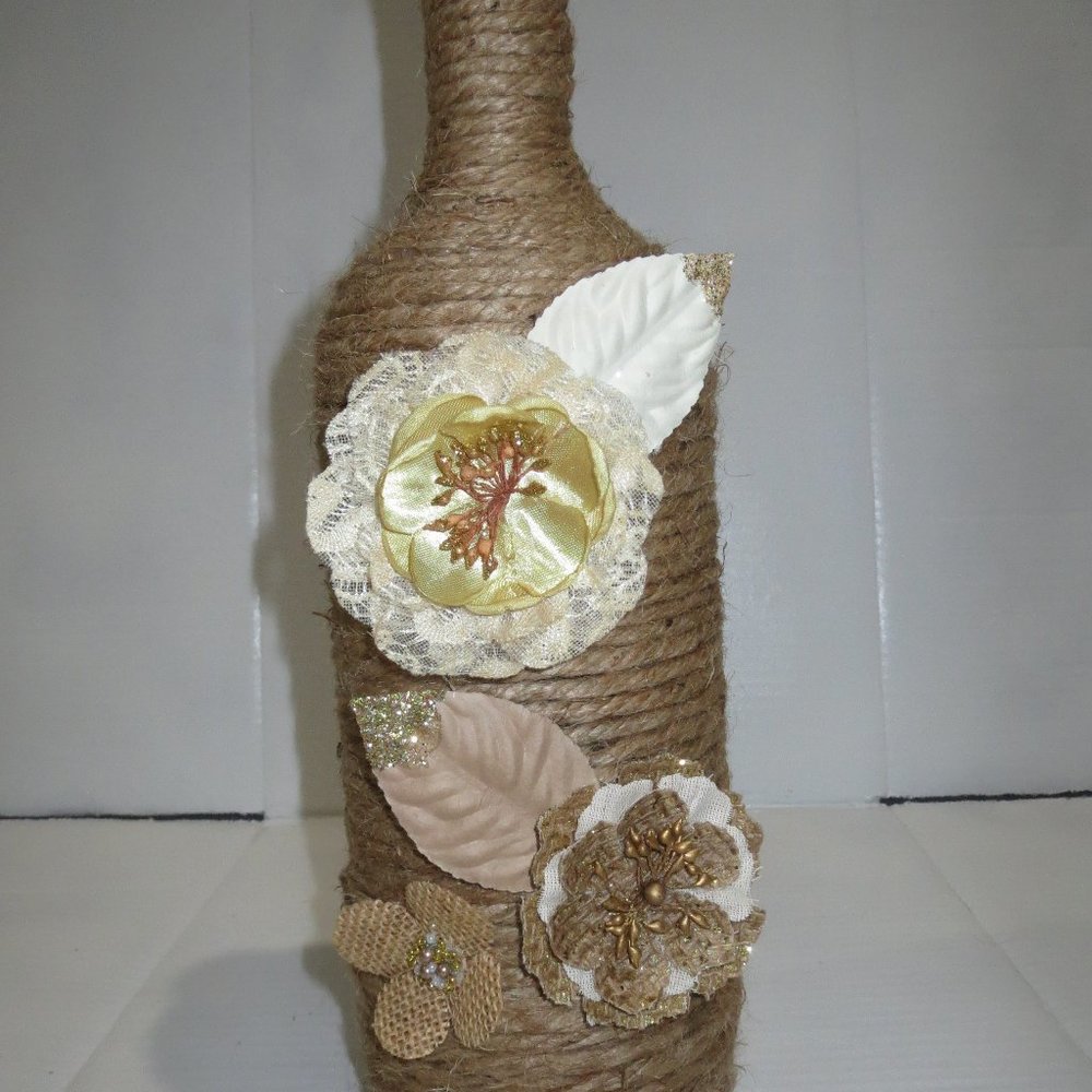 Jute wrapped XL wine bottle/vase. Burlap flowers .